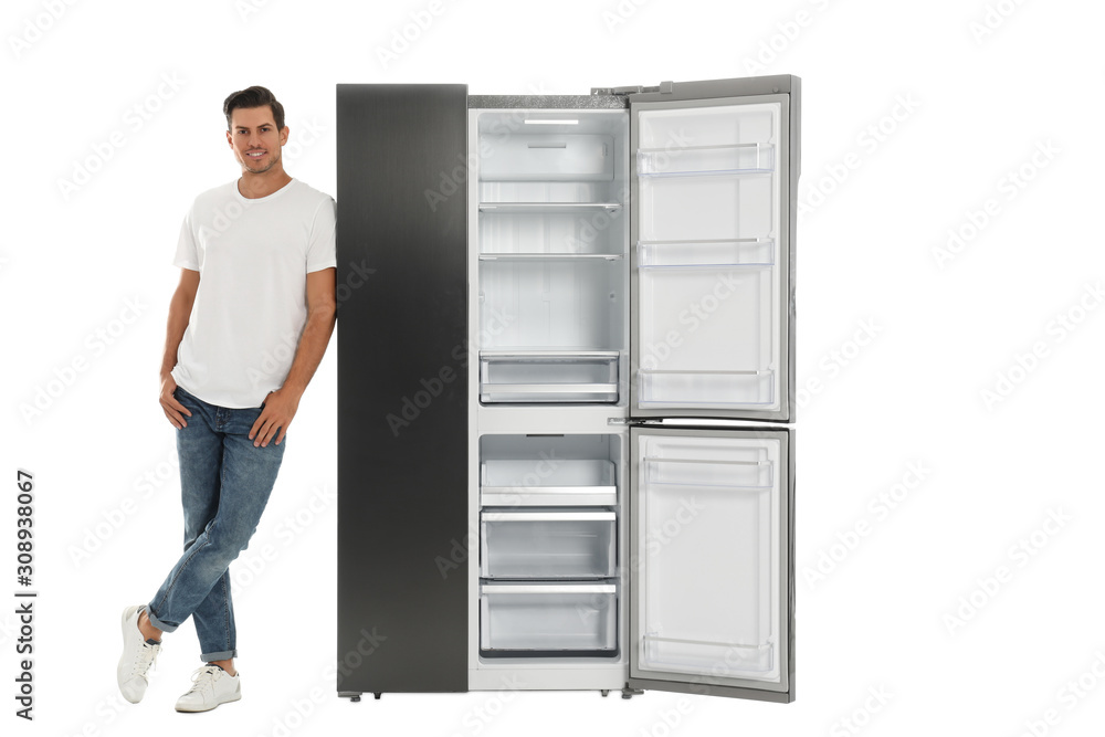 Man near open empty refrigerator on white background Man near open empty refrigerator on white background
