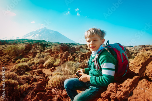 boy hiking in mountains, child travel in Teide national park, Tenerife, Spain