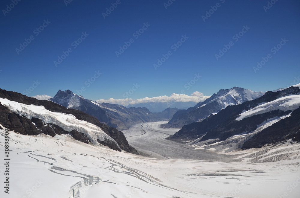 A beautiful peak and panoramic snow mountain view of Jungfraujoch. One of the most popular experiences in the beautiful Bernese Oberland is the train journey to Jungfraujoch, the 