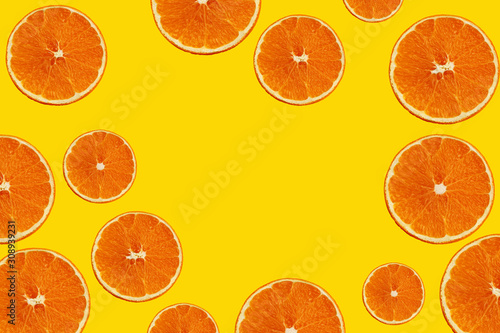 texture with juicy slices of orange, lemon, lime on a yellow background for a menu or recipe, concept of vegetarian, vitamin and wholesome food, background, pattern for textile, wallpaper, copy space
