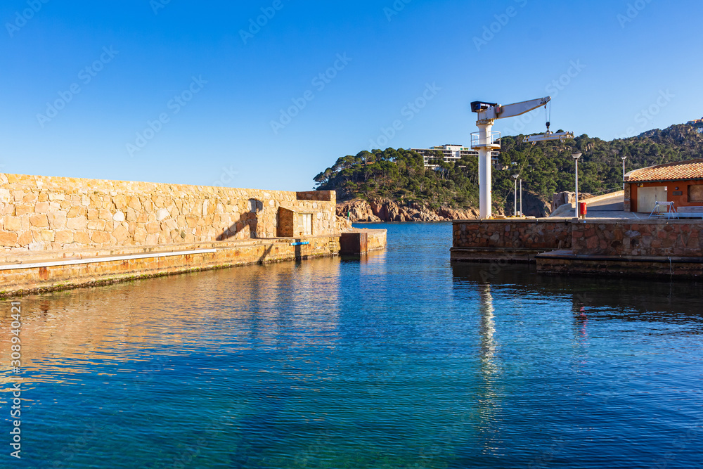 Naklejka premium View of the exit of the fishing port of Fornells, Begur, Costa Brava, Catalonia, Spain