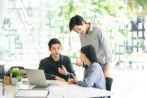 Business team discussing together in conference room during meeting at office. Teamwork, brainstorm and ideas concept. saleperson using tablet and presentation somthing to client.