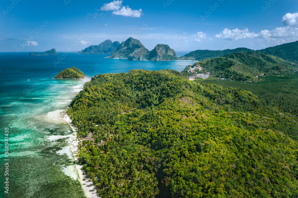 El Nido, Palawan, Philippines. Panoramic aerial view of exotic tropical Bacuit archipelago coastline with beautiful islands, blue lagoons and palm trees