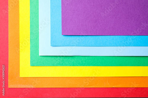 Sheets of multicolored paper, top view. Rainbow palette