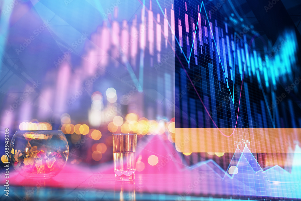 Obraz premium Financial graph colorful drawing and table with computer on background. Double exposure. Concept of international markets.