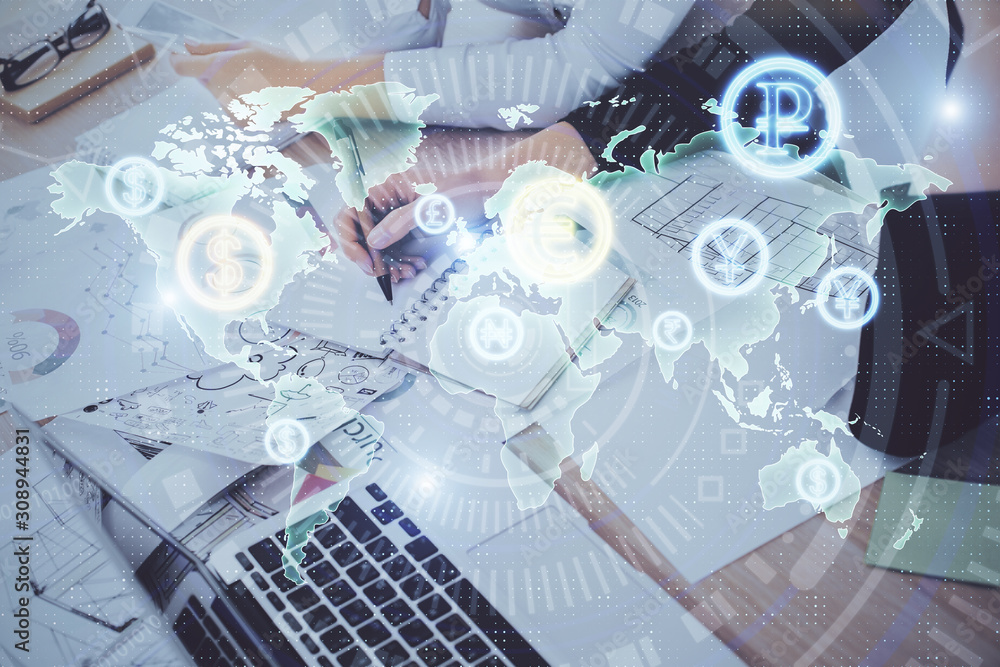A woman hands writing information about stock market in notepad. Forex chart holograms in front. Concept of research. Double exposure A woman hands writing information about stock market in notepad. Forex chart holograms in front. Concept of research. Double exposure