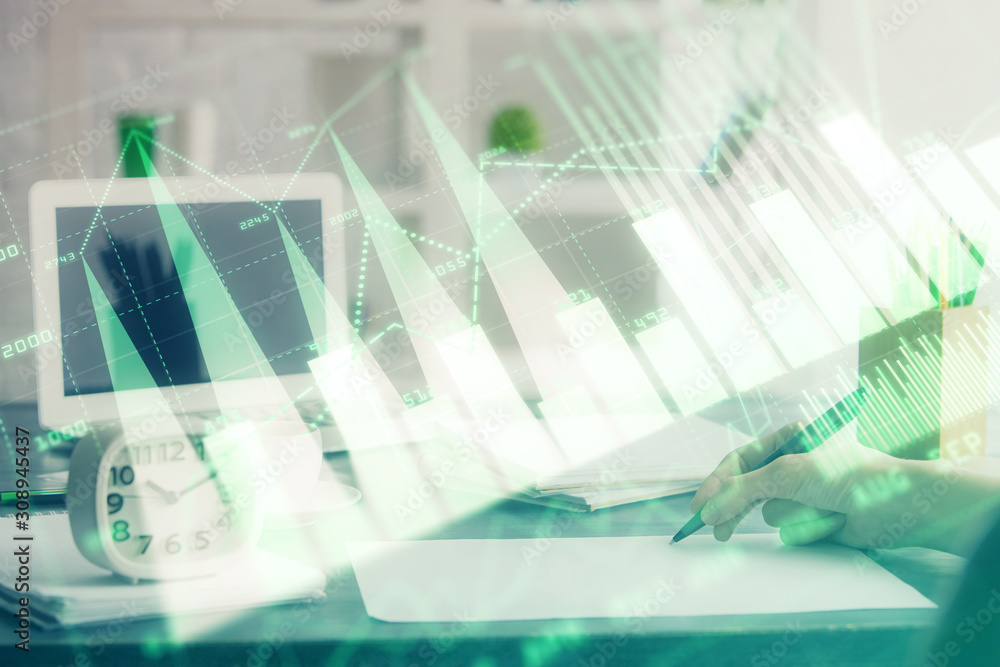 Financial graph displayed on woman's hand taking notes background. Concept of research. Multi exposure Financial graph displayed on woman's hand taking notes background. Concept of research. Multi exposure