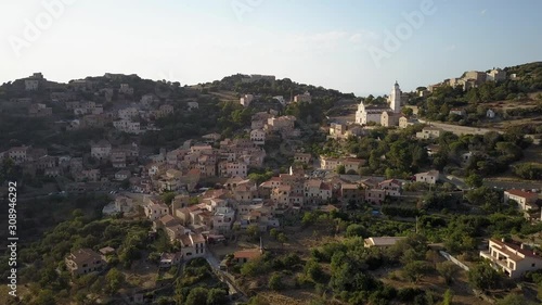 Aerial drone forward flight footage in the afternoon time of Corbara village in the Corse island near Ile la Rousse, France. photo