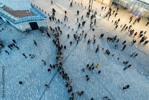 Fototapeta New York, NY - March 15, 2019: People walking around from aerial shot near the h