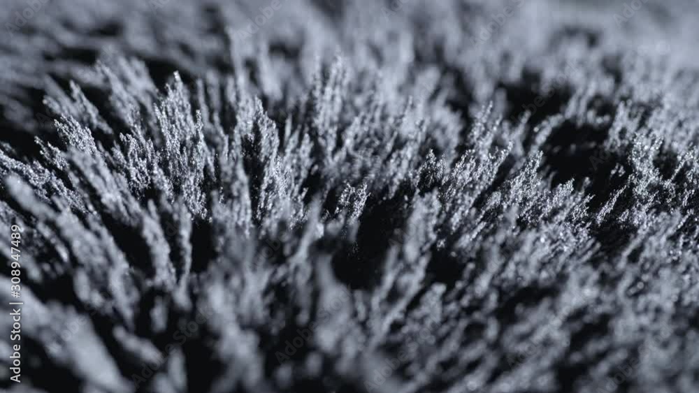 Iron powder under the influence of a magnetic field. Сlose-up. Iron powder under the influence of a magnetic field. Сlose-up.