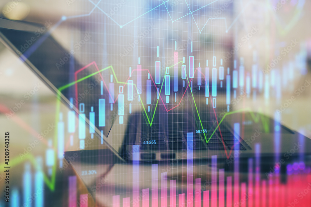 Forex graph hologram on table with computer background. Double exposure. Concept of financial markets. Forex graph hologram on table with computer background. Double exposure. Concept of financial markets.