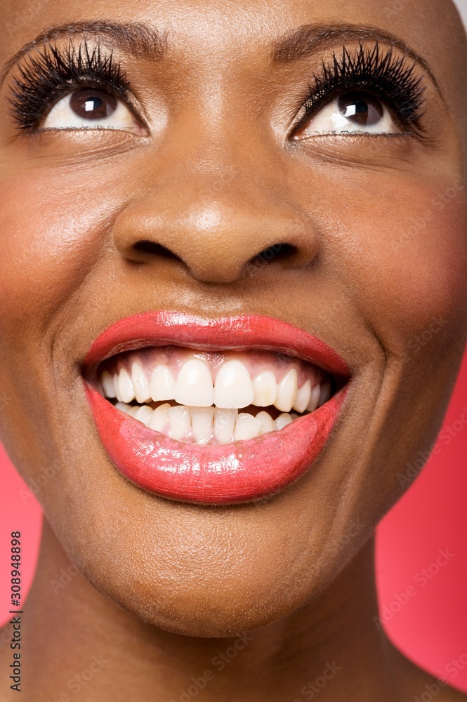 Close up of cheerful woman looking up Close up of cheerful woman looking up