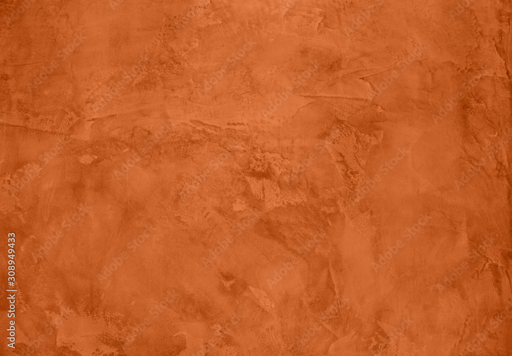 Saturated orange colored low contrast Concrete textured background with roughness and irregularities. 2020 color trend.