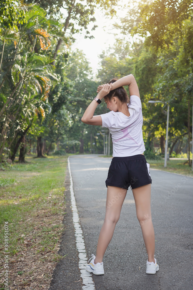 © Anek - Asian women exercising at the park