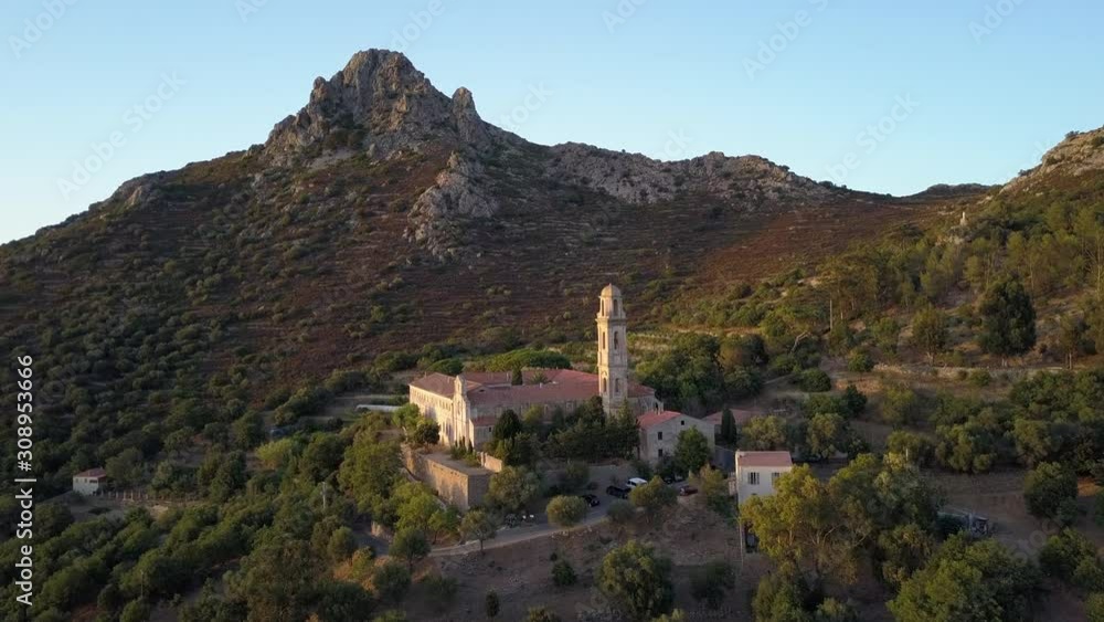Aerial drone forward flight footage to the ancien Corbara abbey in the Corse island, France.