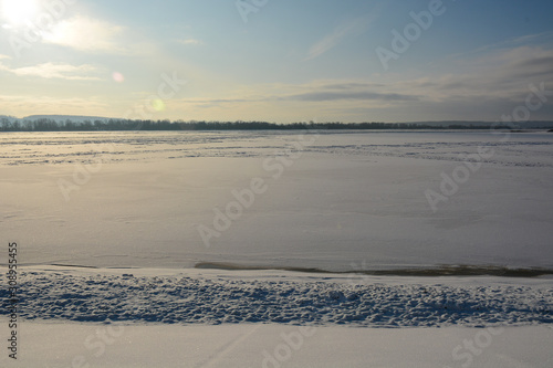Fototapeta Naklejka Na Ścianę i Meble -  NIZHNY NOVGOROD, RUSSIA - DECEMBER 3, 2019: Winter view to frozen Volga river from Trinity Makaryev Zheltovodsky Monastery located in Nizhny Novgorod region in winter