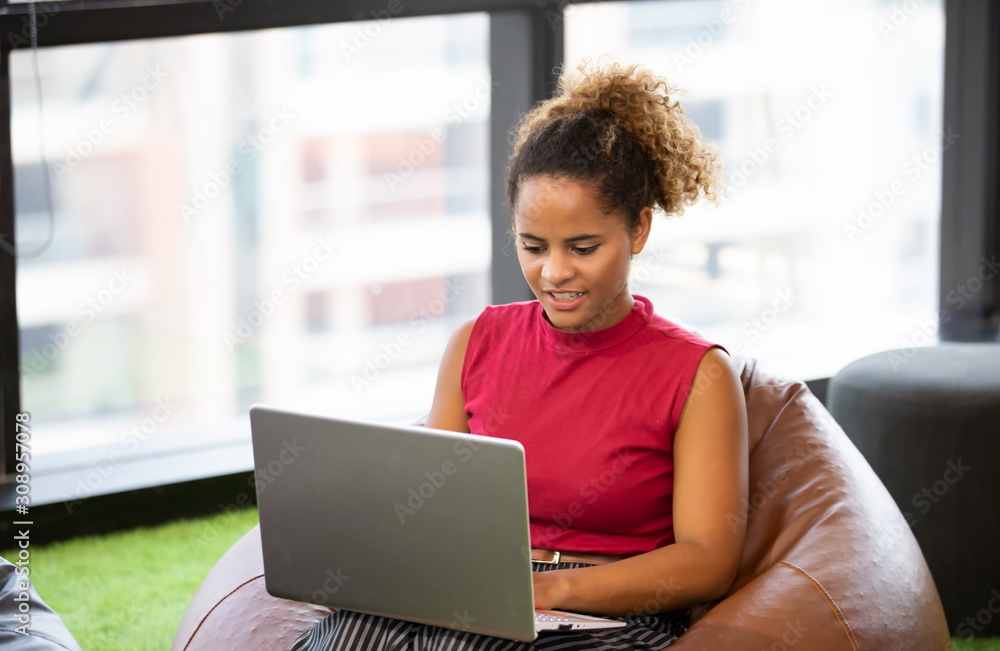Head shot of smiling african american millennial female using laptop Head shot of smiling african american millennial female using laptop