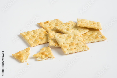 Crispy crackers or cookies on white background.