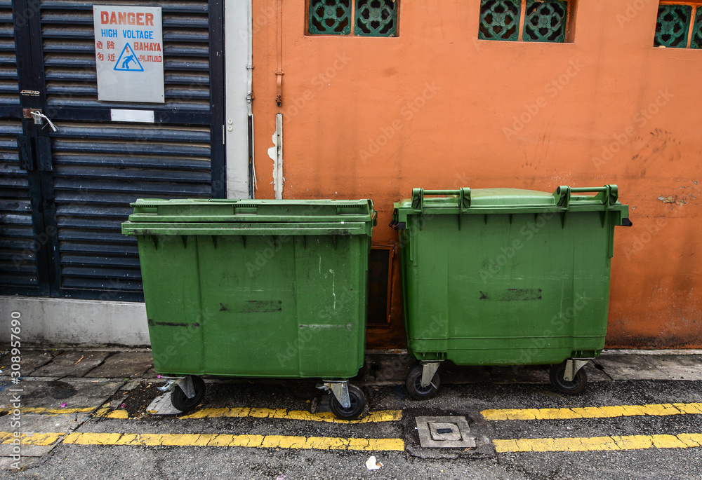 Old metal garbage containers on the street Old metal garbage containers on the street