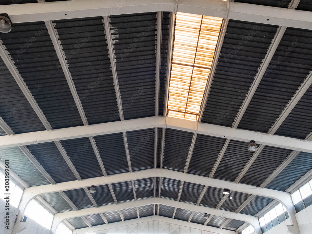 Fototapeta premium Interior of the old warehouse with clerestory on the roof