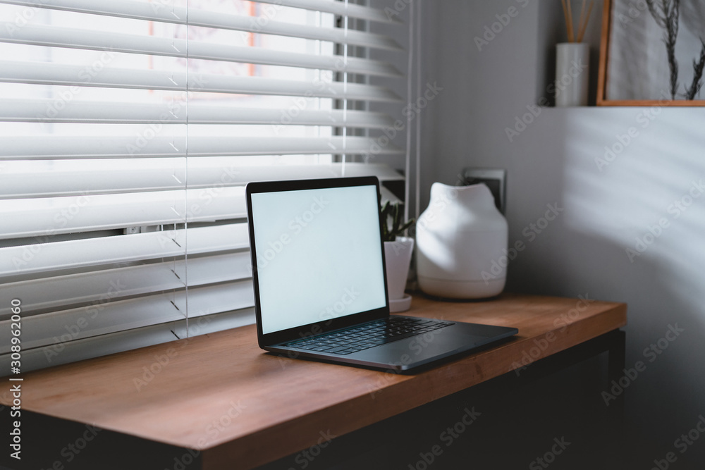Workplace near the window with laptop and computer. Copy space. use in Traditional Chinese Alphabet operating system. Workplace near the window with laptop and computer. Copy space. use in Traditional Chinese Alphabet operating system.