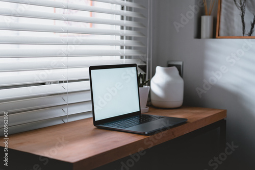 Wallpaper Mural Workplace near the window with laptop and computer. Copy space. use in Traditional Chinese Alphabet operating system. Torontodigital.ca