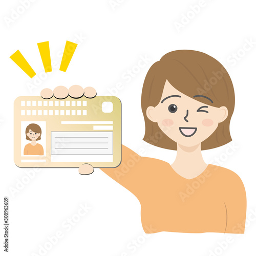 マイナンバーカードを持ってる女性（アップ）