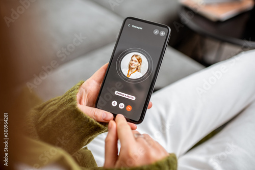 Slika na platnu Woman making video call to a doctor using digital tablet, feeling bad at home