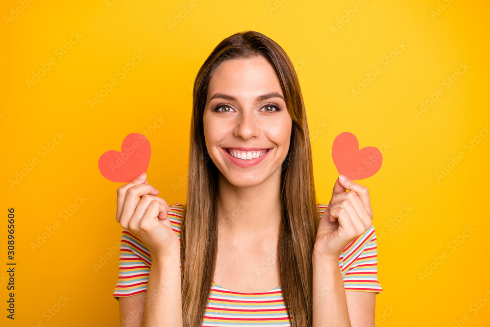 I like it. Closeup photo of funny lady holding hands little red paper hearts flirty girlish mood expressing agreement wear casual striped t-shirt isolated yellow color background I like it. Closeup photo of funny lady holding hands little red paper hearts flirty girlish mood expressing agreement wear casual striped t-shirt isolated yellow color background