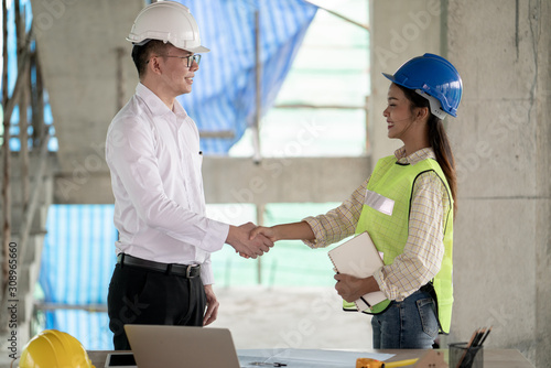 Engineer project manager and admin site shake hand for success in project construction site