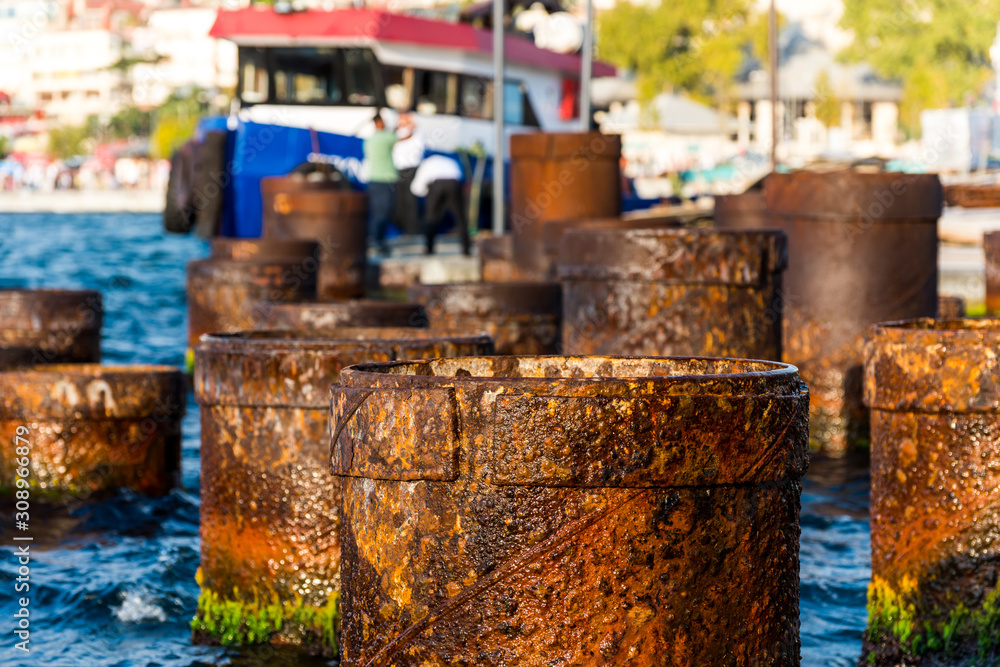 Rusty Steel Pipe berth for boats Coming From Out Of Sea at the Uskudar Istanbul, Turkey, on the Anatolian shore of the Bosphorus. Rusty Steel Pipe berth for boats Coming From Out Of Sea at the Uskudar Istanbul, Turkey, on the Anatolian shore of the Bosphorus.