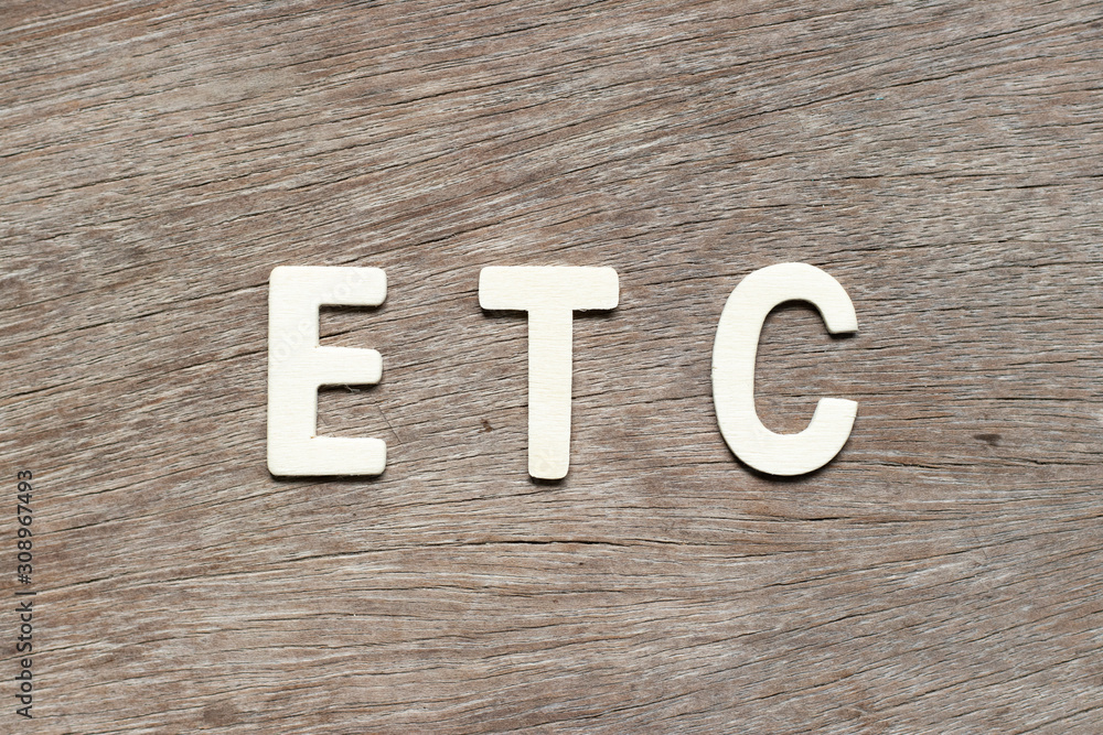Alphabet letter in word etc (abbreviation of et cetera) on wood