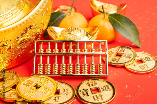 Chinese new year ornament--gold ingot,orange,golden coin and golden abacus,Chinese calligraphy Translation:good bless for new year photo