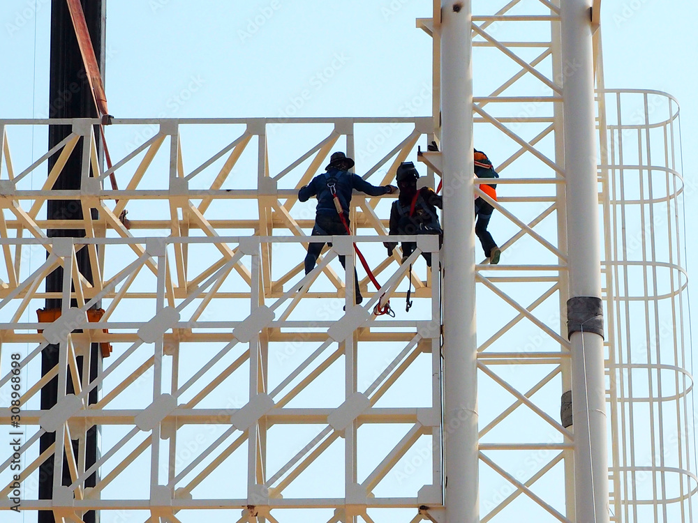 Man Working on the Working at height in construction site