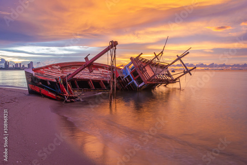 Old shipwrecked on the beach Shipwreck at Krating Beach, Pattaya, Thailand