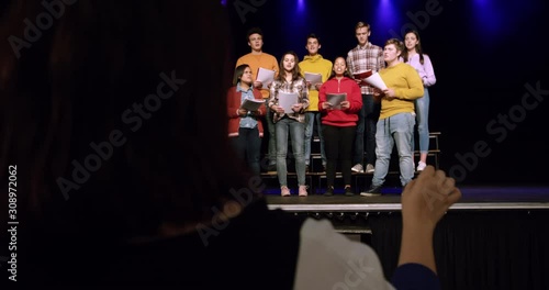 Teenagers rehearsing in a theatre photo