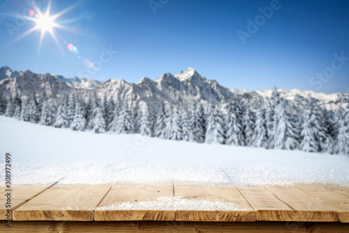 Table background of free space and landscape of winter window.  © magdal3na