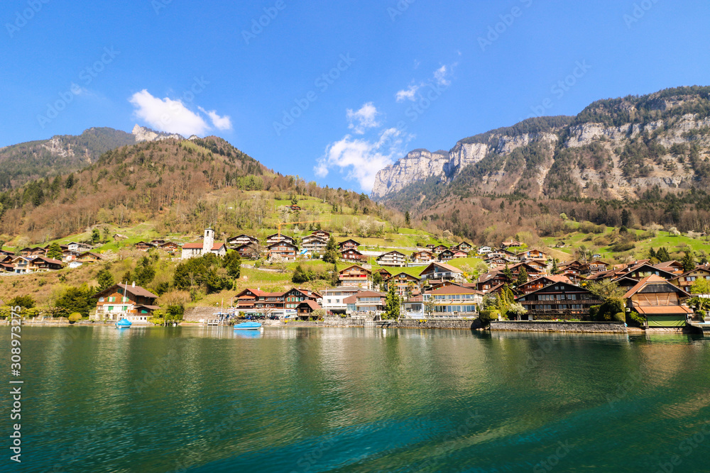Beautiful view of lake Thun and many houses during spring season with mountain background, Thun, Switzerland