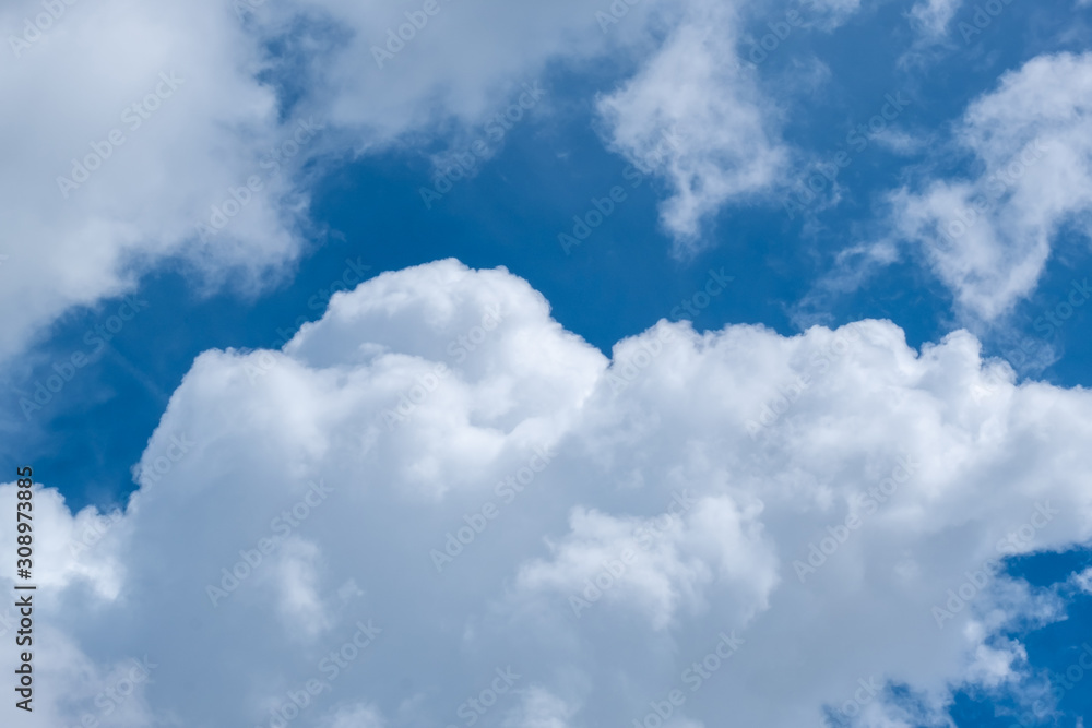 Soft blue sky with clouds and sun flare. Soft blue sky with clouds and sun flare.