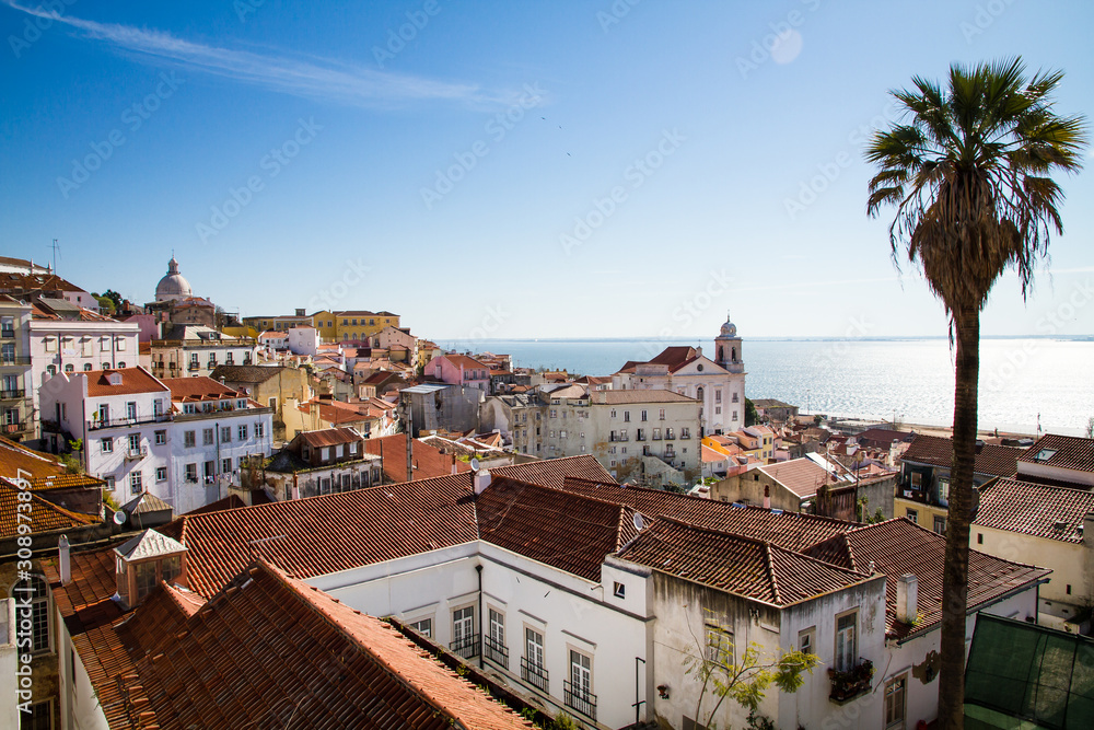 Lisbon, Portugal: Aerial View of the Old Alfama Quarter on the Hill with Blue Sky