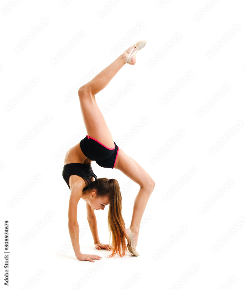 Flexible cute little girl child gymnast doing acrobatic exercise isolated Flexible cute little girl child gymnast doing acrobatic exercise isolated