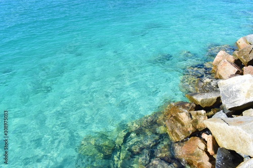 Turquoise water and rocks of Miami beach South point park pier