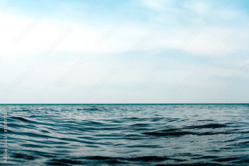 Natural dark blue seawater surface with blue sky Natural dark blue seawater surface with blue sky