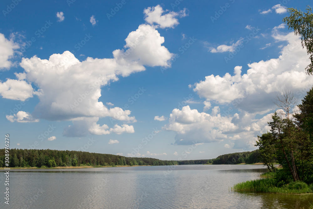 Cumulonimbus clouds over lake, abstract nature background