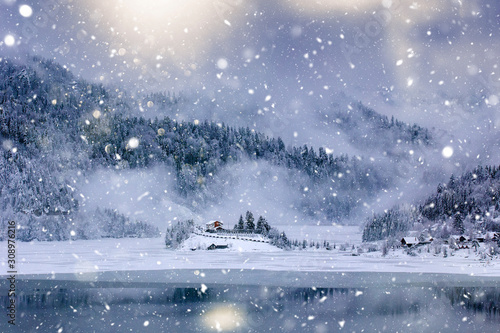 Wooden cottage in a fairy-tale winter landscape. © belyaaa
