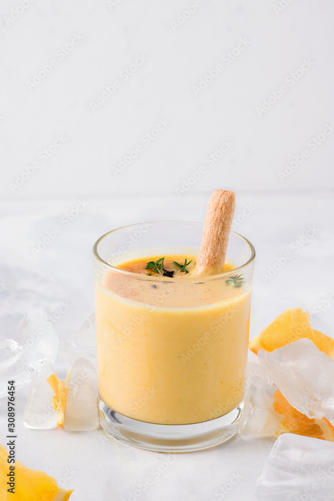 lassi drink mango closeup on a light concrete background. With copy space. Traditional drink lassi drink mango closeup on a light concrete background. With copy space. Traditional drink