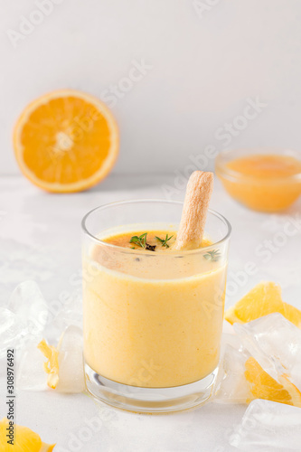 lassi drink mango closeup on a light concrete background. Milk smoothie