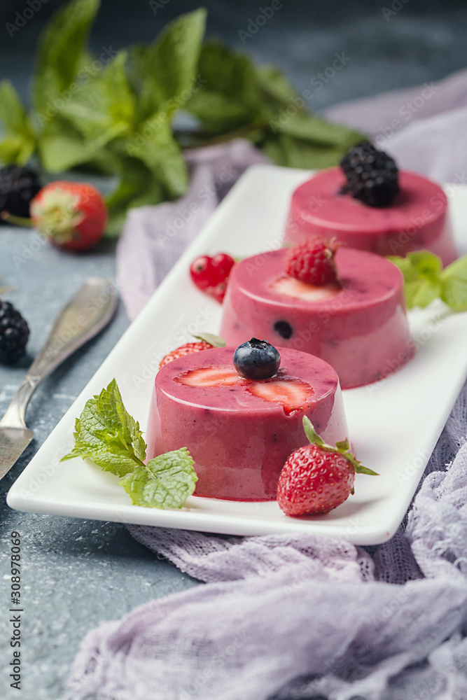Summer dessert with berries and yogurt as a jelly pudding Summer dessert with berries and yogurt as a jelly pudding