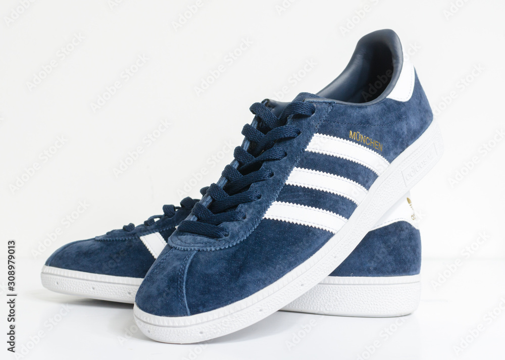 london, england, 05/05/2018 Adidas Munchen gazelle vintage sneaker  trainers. Blue suede adidas trainers, stylish retro football street  fashion. famous three stripes Stock Photo | Adobe Stock