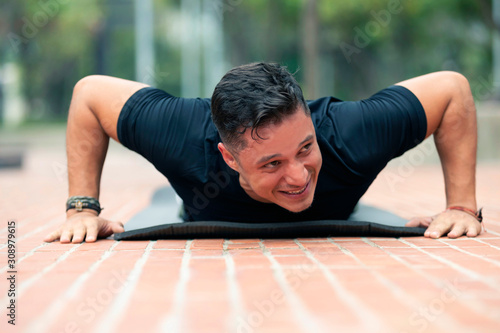 Young man exercising outdoors.